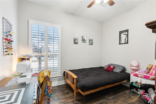 bedroom with dark wood-type flooring and ceiling fan