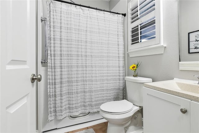 full bathroom featuring vanity, toilet, and shower / tub combo with curtain