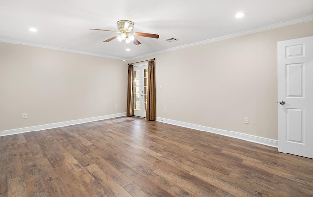 spare room with wood-type flooring, ornamental molding, and ceiling fan