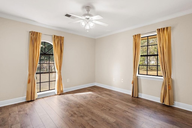 spare room featuring hardwood / wood-style flooring, ornamental molding, and ceiling fan