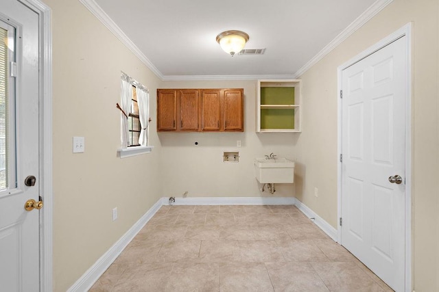 washroom featuring light tile patterned flooring, cabinets, ornamental molding, electric dryer hookup, and washer hookup