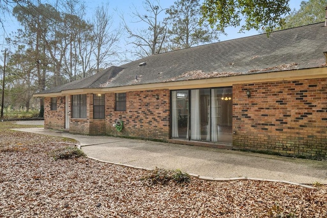 rear view of property featuring a patio area