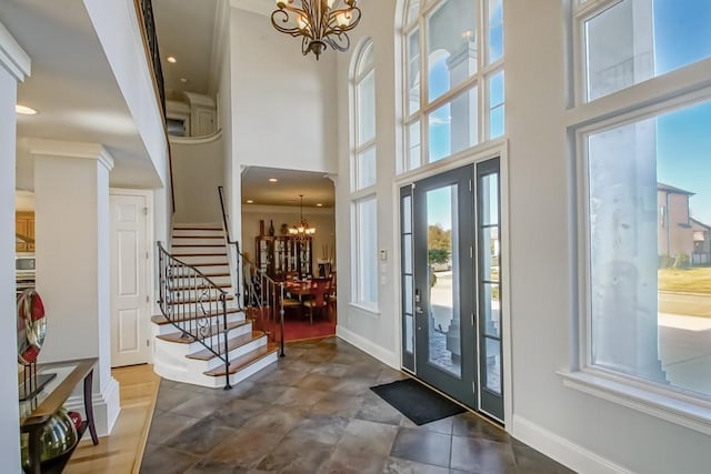 entrance foyer featuring a high ceiling and an inviting chandelier