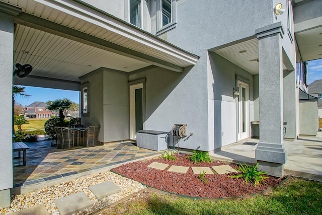 doorway to property with a patio area