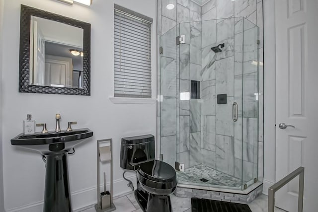 bathroom with tile patterned floors, a shower with shower door, and sink