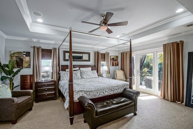 carpeted bedroom featuring crown molding, a raised ceiling, and access to outside