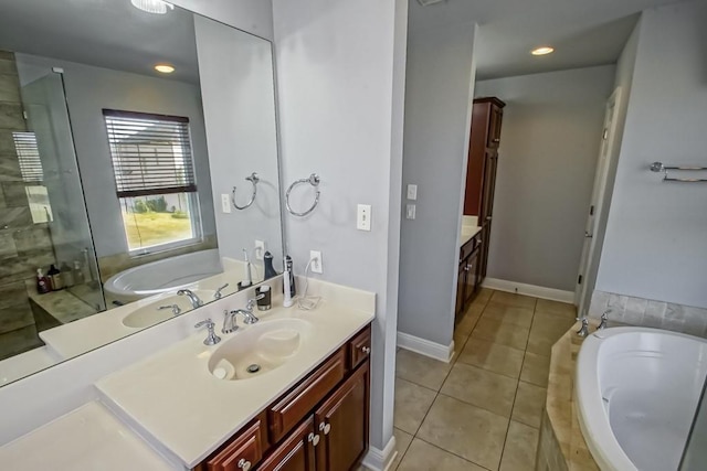 bathroom with vanity, tile patterned flooring, and plus walk in shower