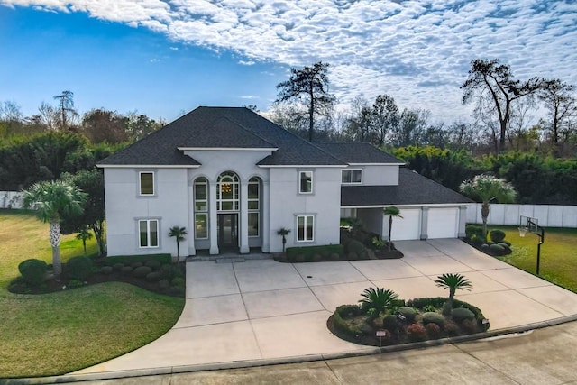 view of front facade featuring a garage and a front lawn