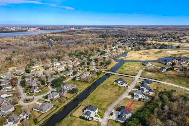 birds eye view of property with a water view