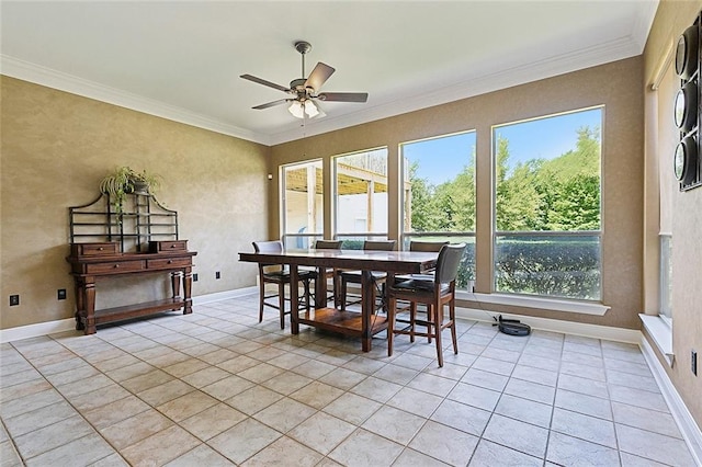 sunroom / solarium featuring ceiling fan