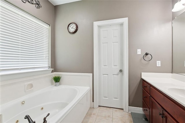 full bathroom with a jetted tub, tile patterned flooring, and vanity