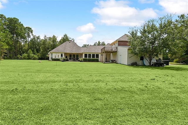 back of house with a yard