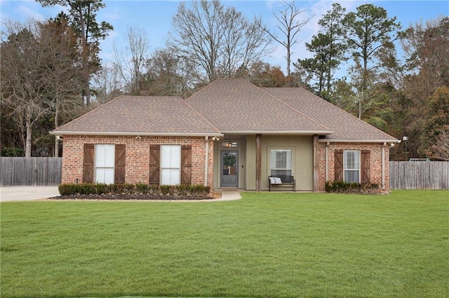 ranch-style home featuring a front yard