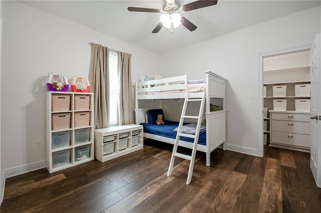 bedroom with dark hardwood / wood-style floors and ceiling fan