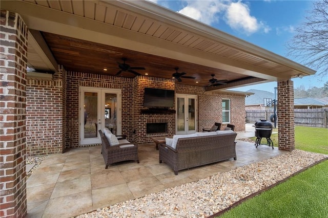 view of patio featuring ceiling fan, an outdoor hangout area, grilling area, and french doors