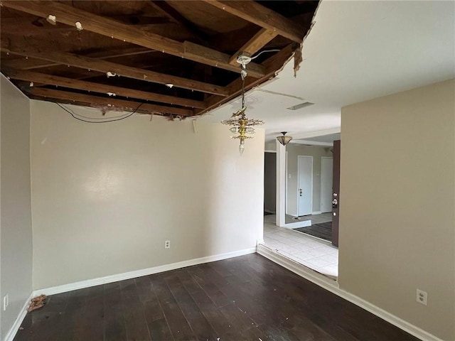 unfurnished room with hardwood / wood-style floors