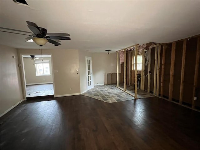 empty room with ceiling fan and wood-type flooring