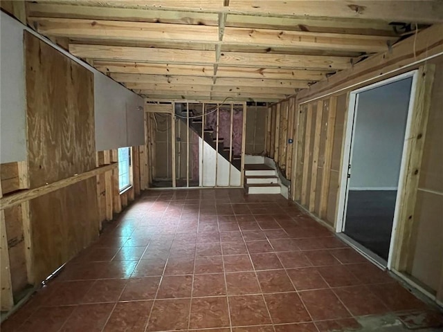 basement with dark tile patterned floors