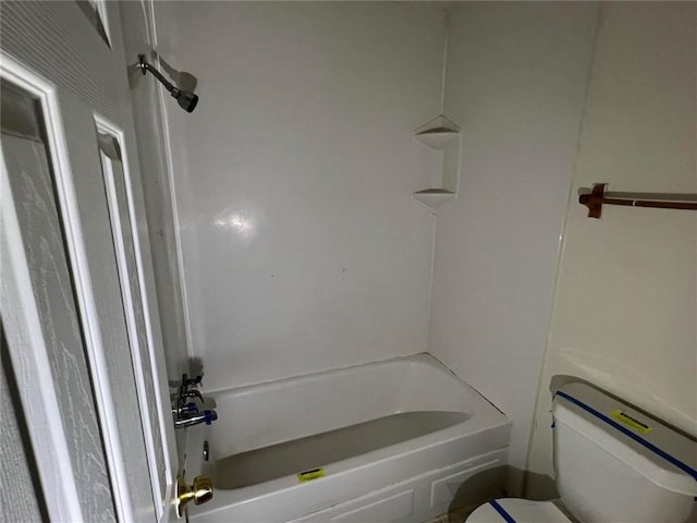 bathroom with shower / bathtub combination and toilet