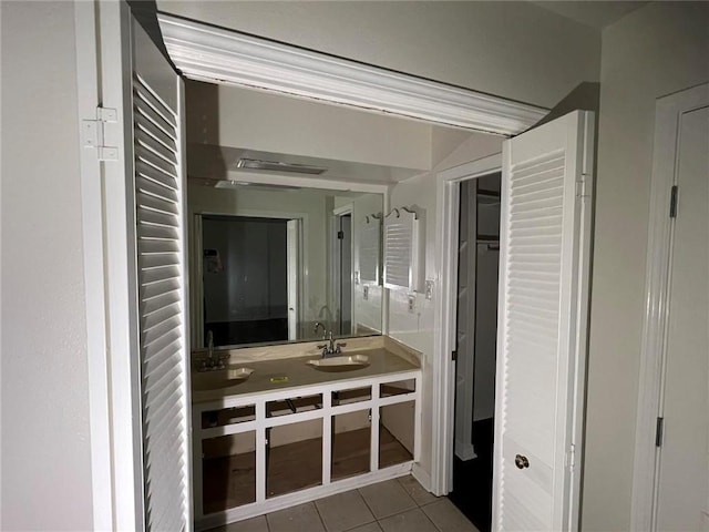 bathroom featuring tile patterned flooring and vanity