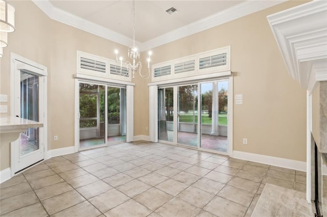 empty room featuring crown molding, a towering ceiling, a chandelier, and light tile patterned floors