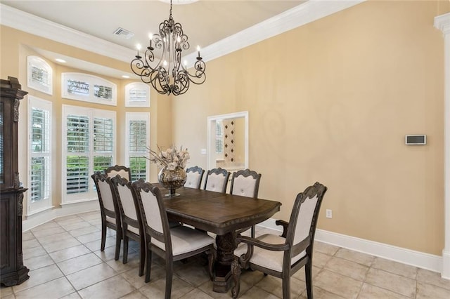 dining room with ornamental molding, light tile patterned flooring, and a chandelier