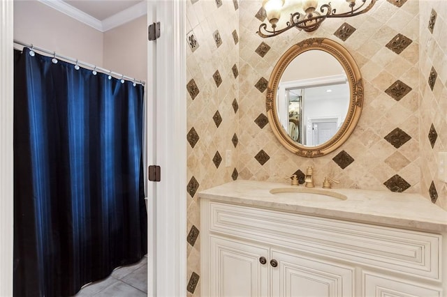 bathroom featuring crown molding, vanity, and backsplash