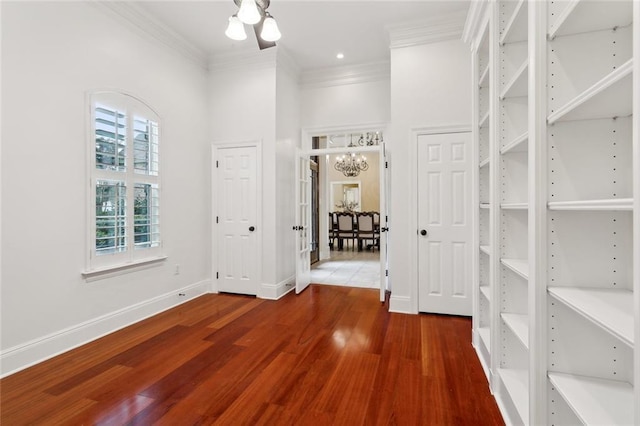 interior space featuring an inviting chandelier and dark hardwood / wood-style flooring