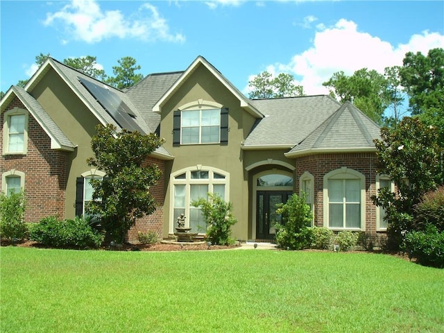 view of front of home with a front lawn