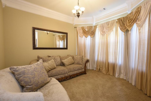 carpeted living room with ornamental molding and a chandelier