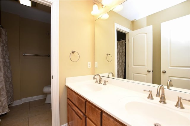 bathroom featuring tile patterned floors, toilet, and vanity