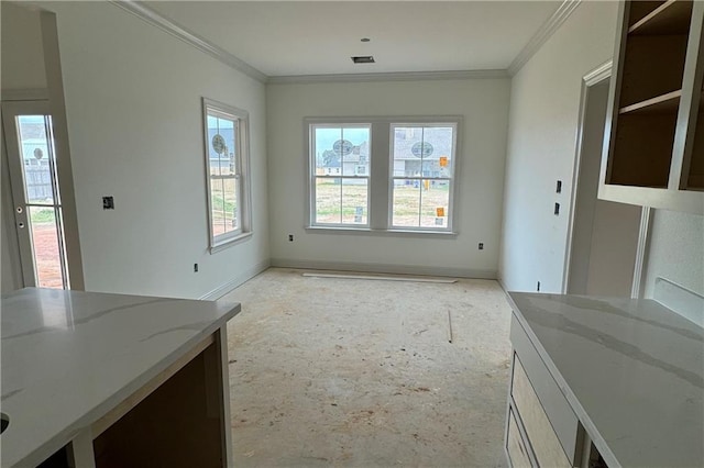 unfurnished dining area featuring ornamental molding