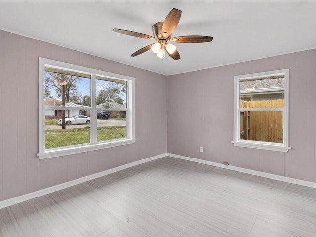 unfurnished room featuring ceiling fan