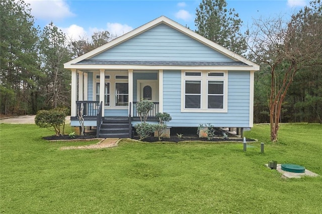 view of front of house with covered porch and a front yard