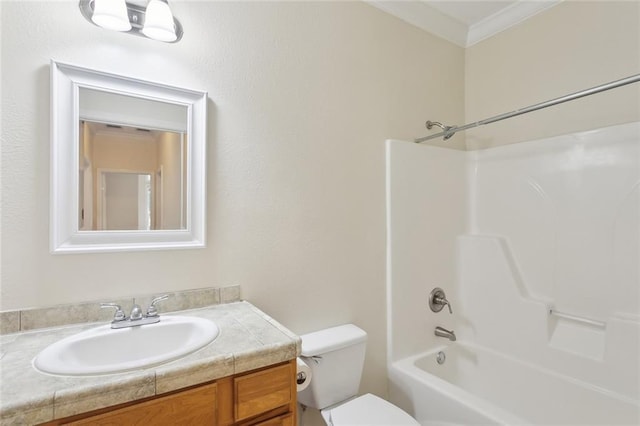 full bathroom with vanity, crown molding, toilet, and washtub / shower combination