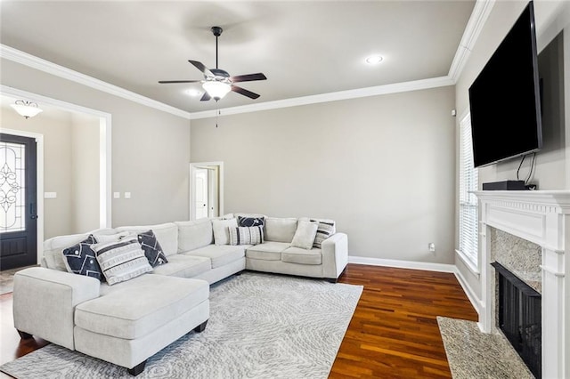 living room with crown molding, ceiling fan, and dark hardwood / wood-style flooring