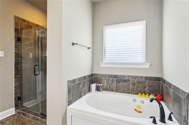 bathroom with independent shower and bath