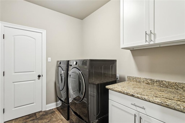 laundry room featuring cabinets and independent washer and dryer