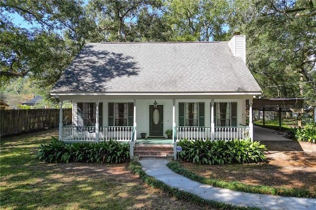 view of front of property featuring a carport and covered porch