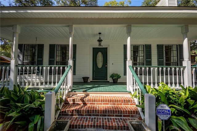 doorway to property featuring a porch