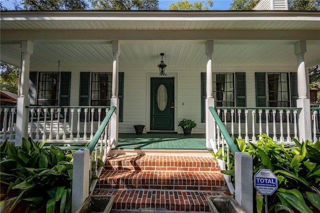 entrance to property with a porch