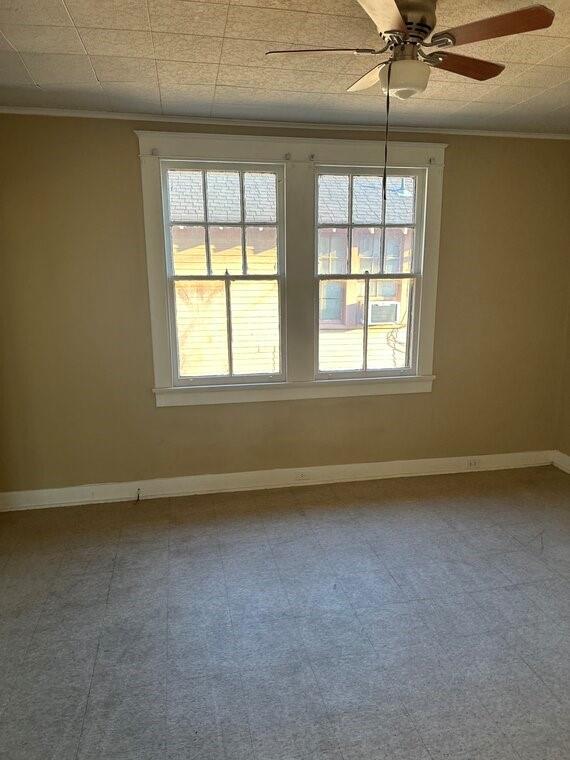 3526 Louisiana Ave Parkway, New Orleans, LA 70125 - empty room featuring crown molding and ceiling fan