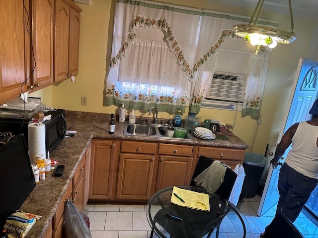3526 Louisiana Ave Parkway, New Orleans, LA 70125 - kitchen featuring cooling unit, sink, and light tile patterned flooring