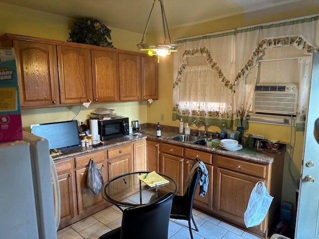 3526 Louisiana Ave Parkway, New Orleans, LA 70125 - kitchen featuring light tile patterned flooring, sink, decorative light fixtures, white refrigerator, and cooling unit