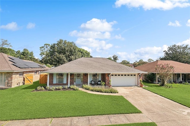 ranch-style house with a garage, covered porch, and a front lawn