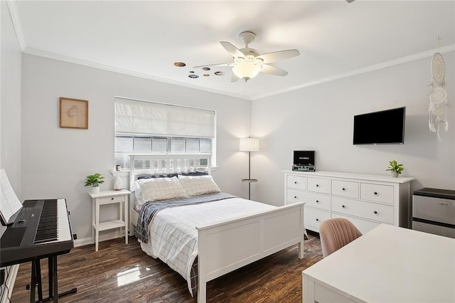 bedroom featuring crown molding, dark wood-type flooring, and ceiling fan