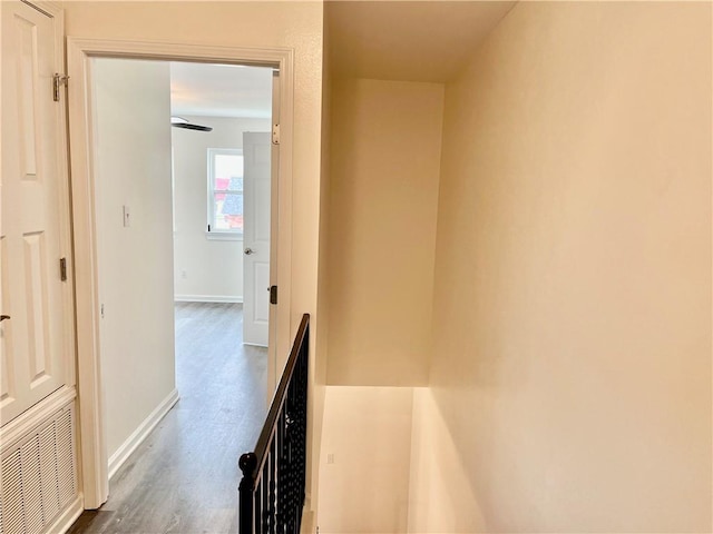 hall with dark hardwood / wood-style floors