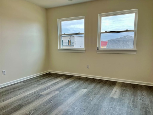 unfurnished room with hardwood / wood-style flooring