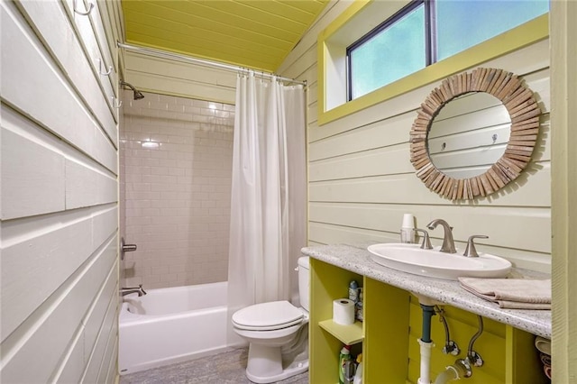 bathroom featuring a sink, toilet, shower / bathtub combination with curtain, lofted ceiling, and wooden ceiling