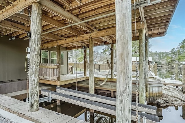 exterior space featuring boat lift and a boat dock